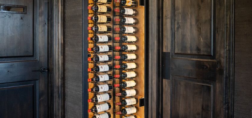 A wine case filled with bottles.